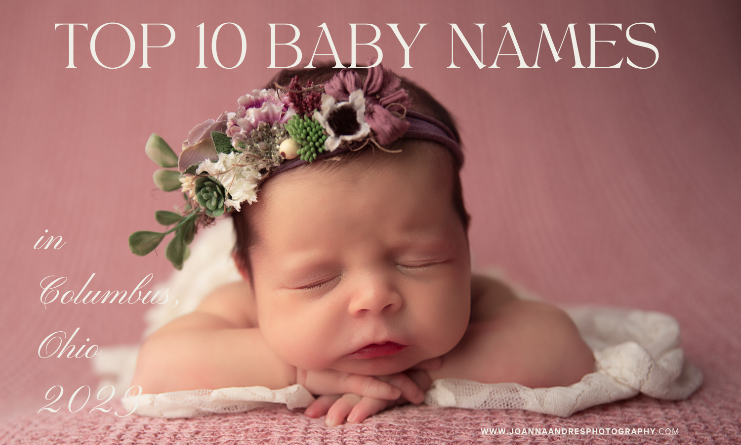 Baby Girl with a mauve floral headband posed with her hands folded under her chin