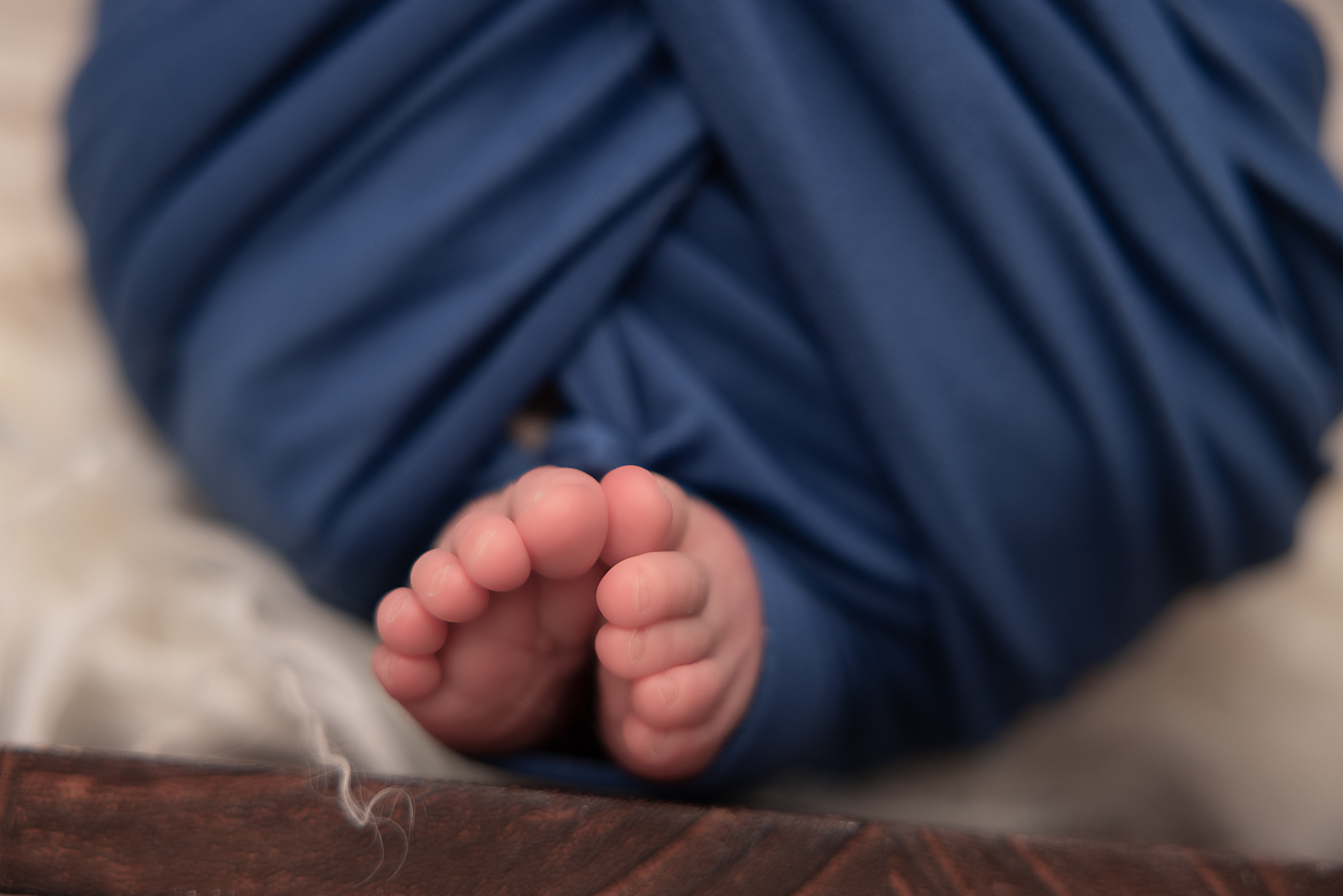 Macro Photo of baby toes wrapped in blue