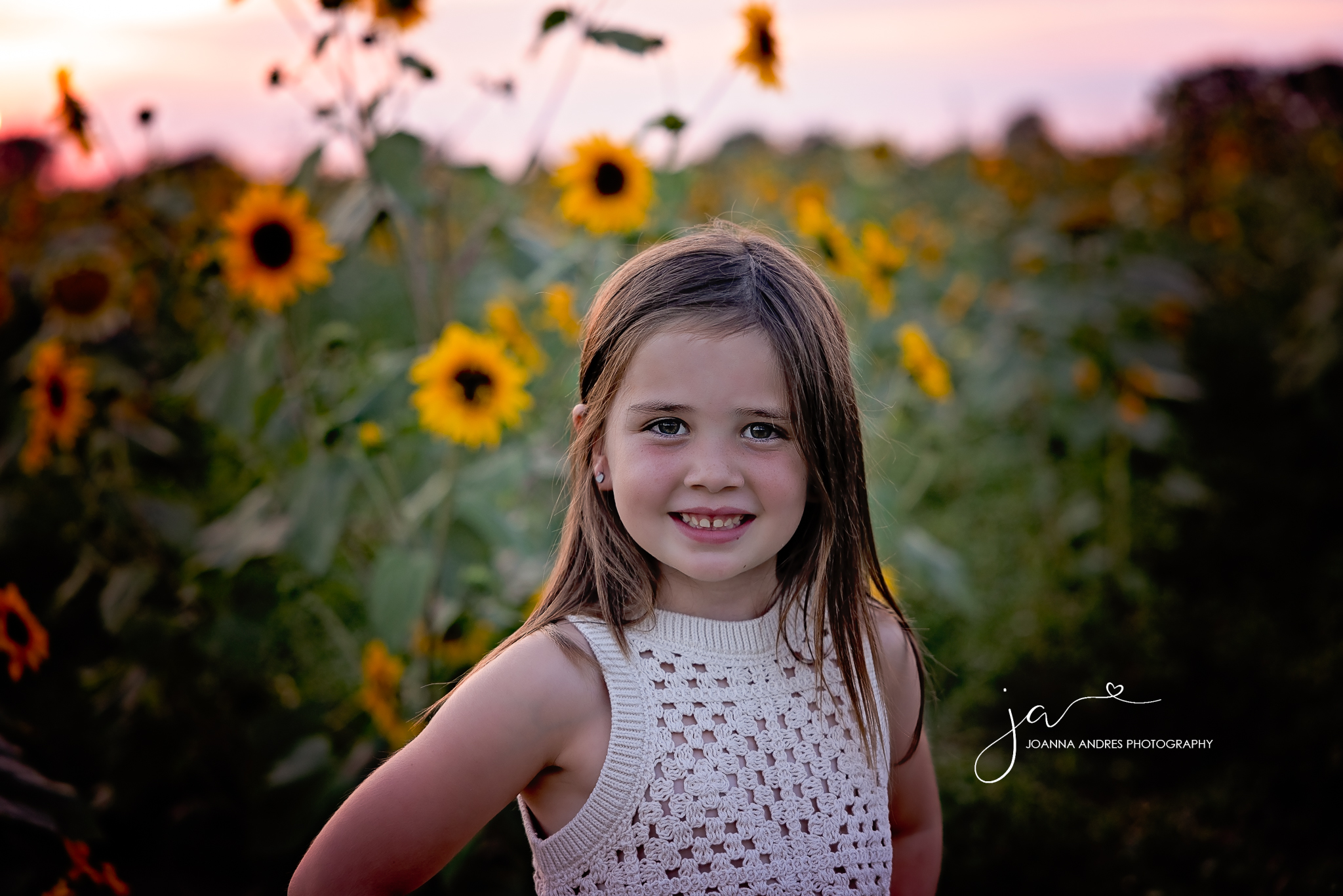 close up of girl with sunflowers surrounding her