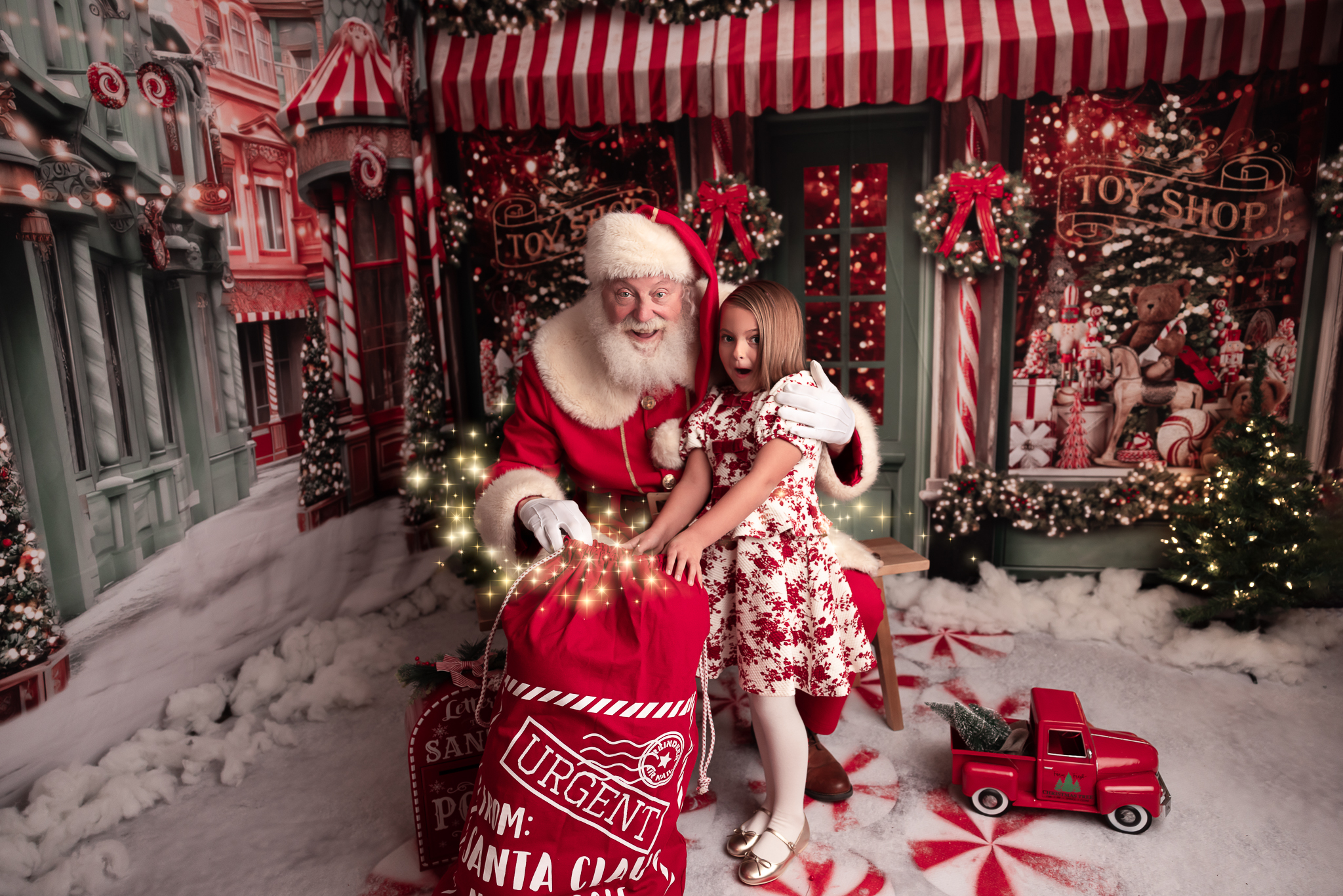 little girl opening the sack of presents with a surprised facial expression and santa is in the photo too