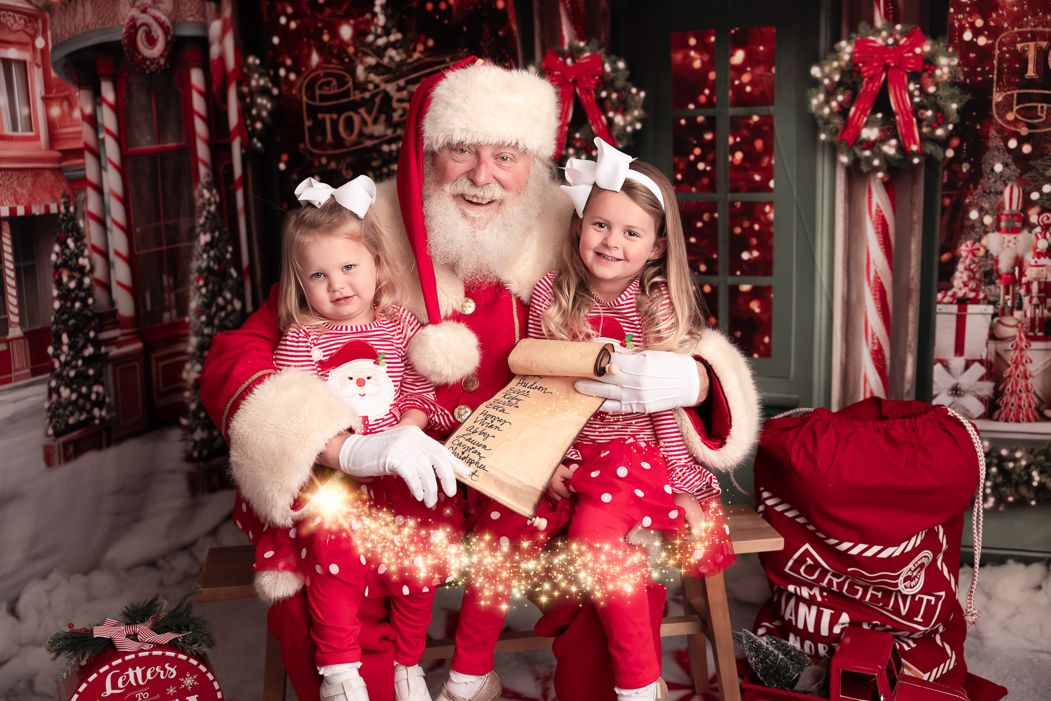 two girls with santa shirt and tutu sitting on santas lap