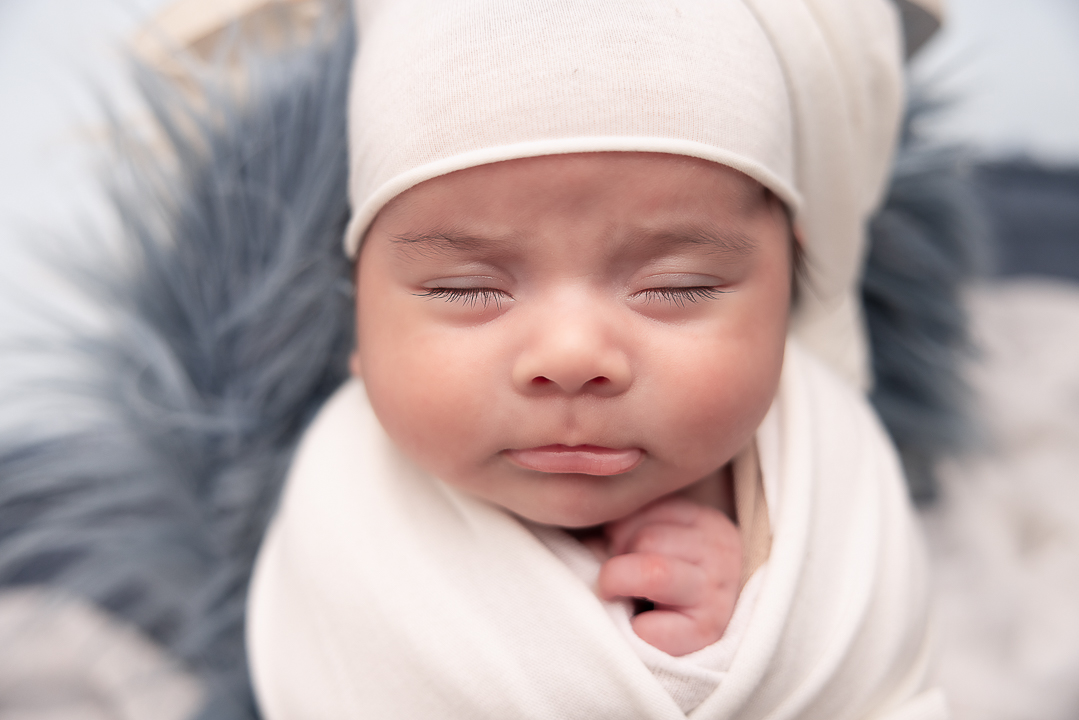 close up of baby boys face where you can see his long lashes