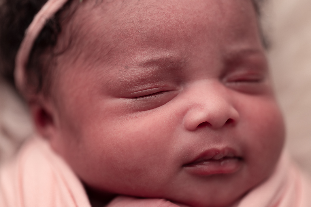 Close up of baby's face and features like eyes, nose and mouth