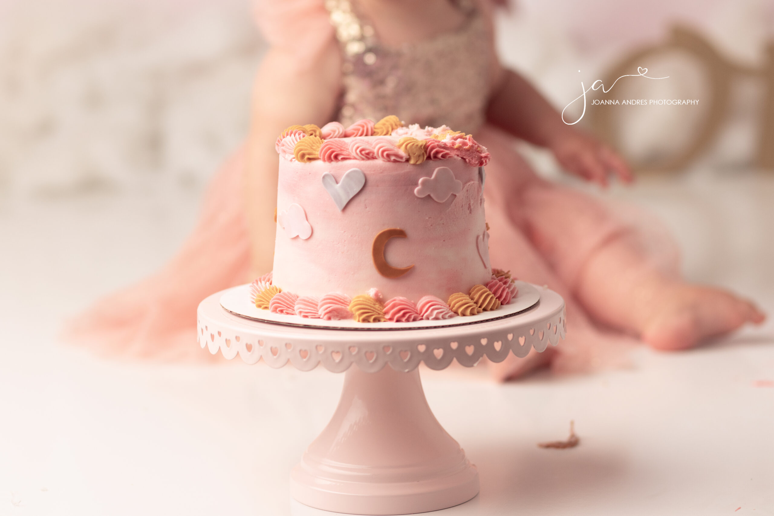 close up of pink cake with moon