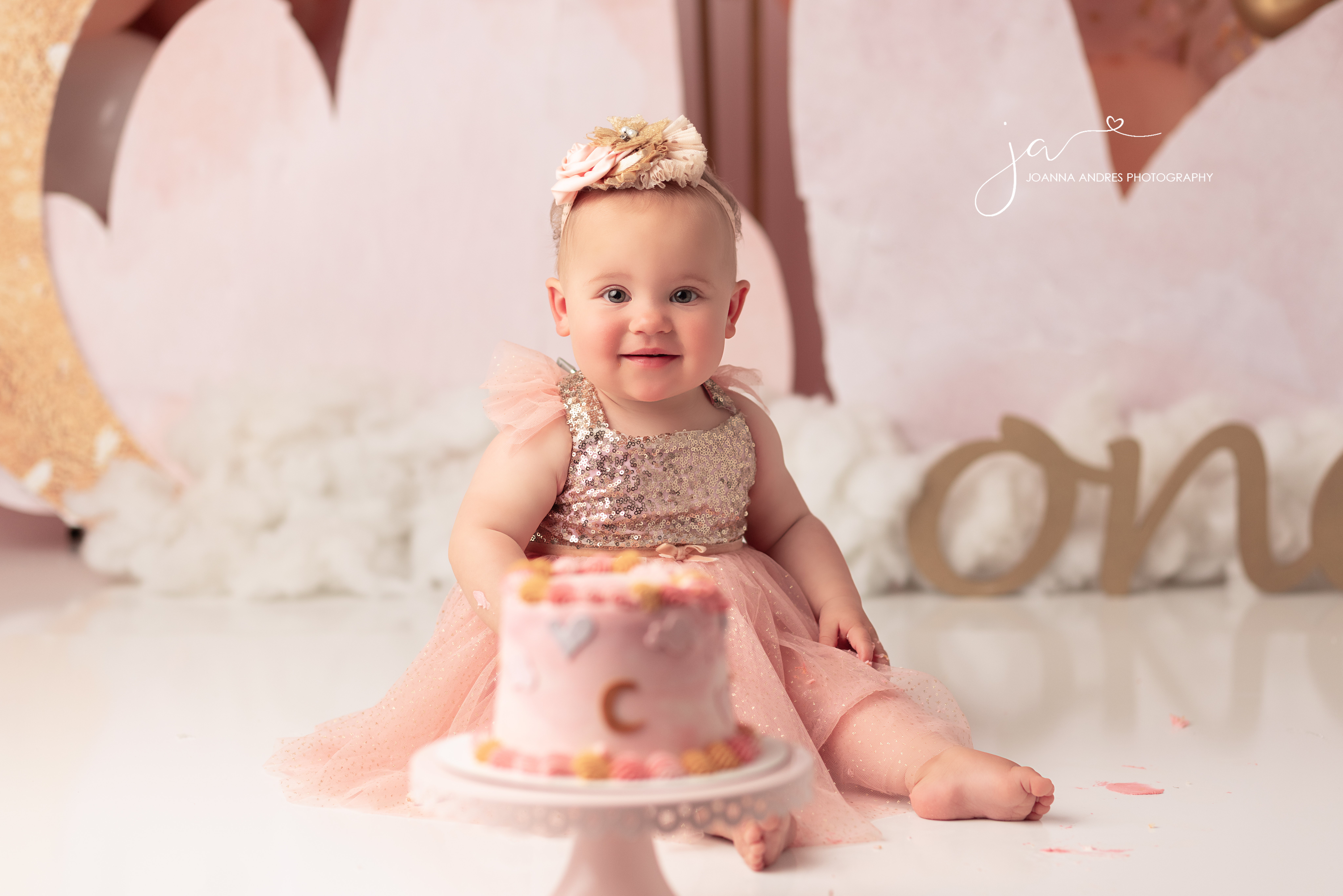 close up of baby with cake