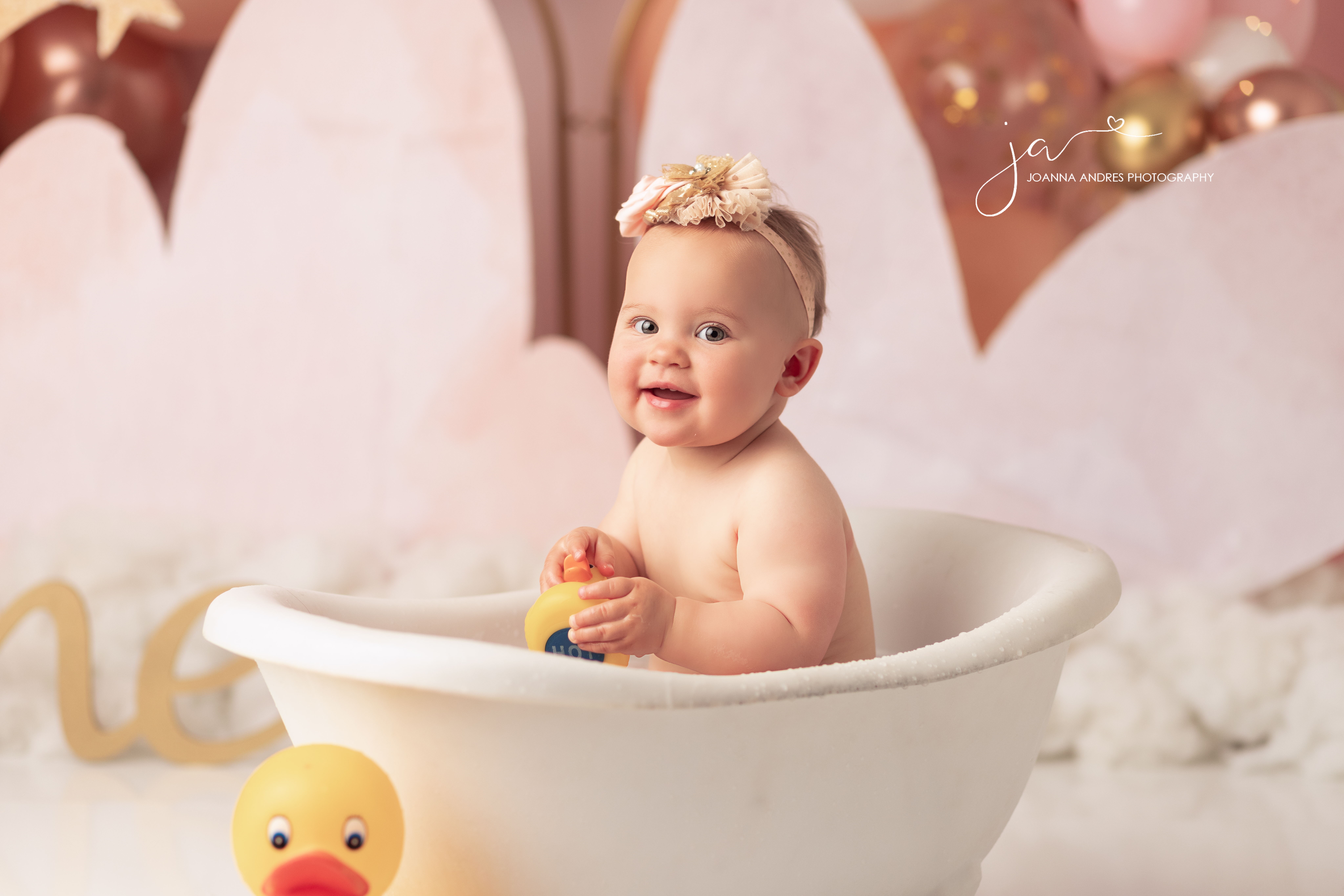 Baby in bathtub smiling