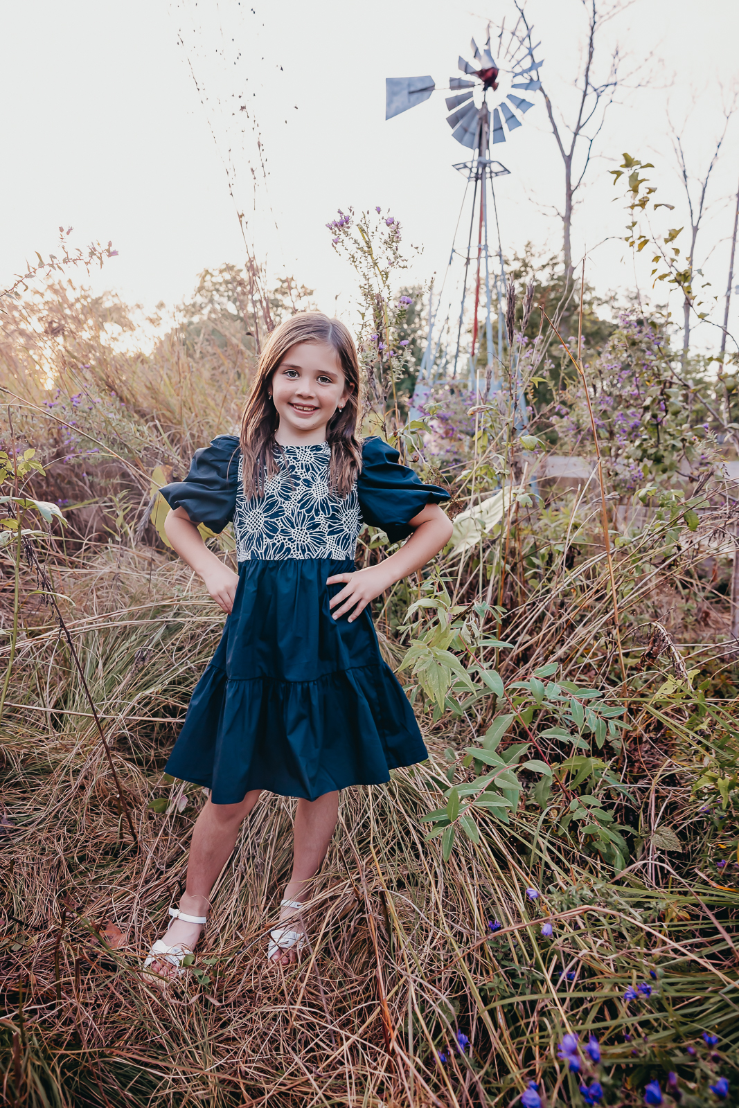 Little girl in the middle of a patch of wildflowers taken at Innis Woods Metro Garden