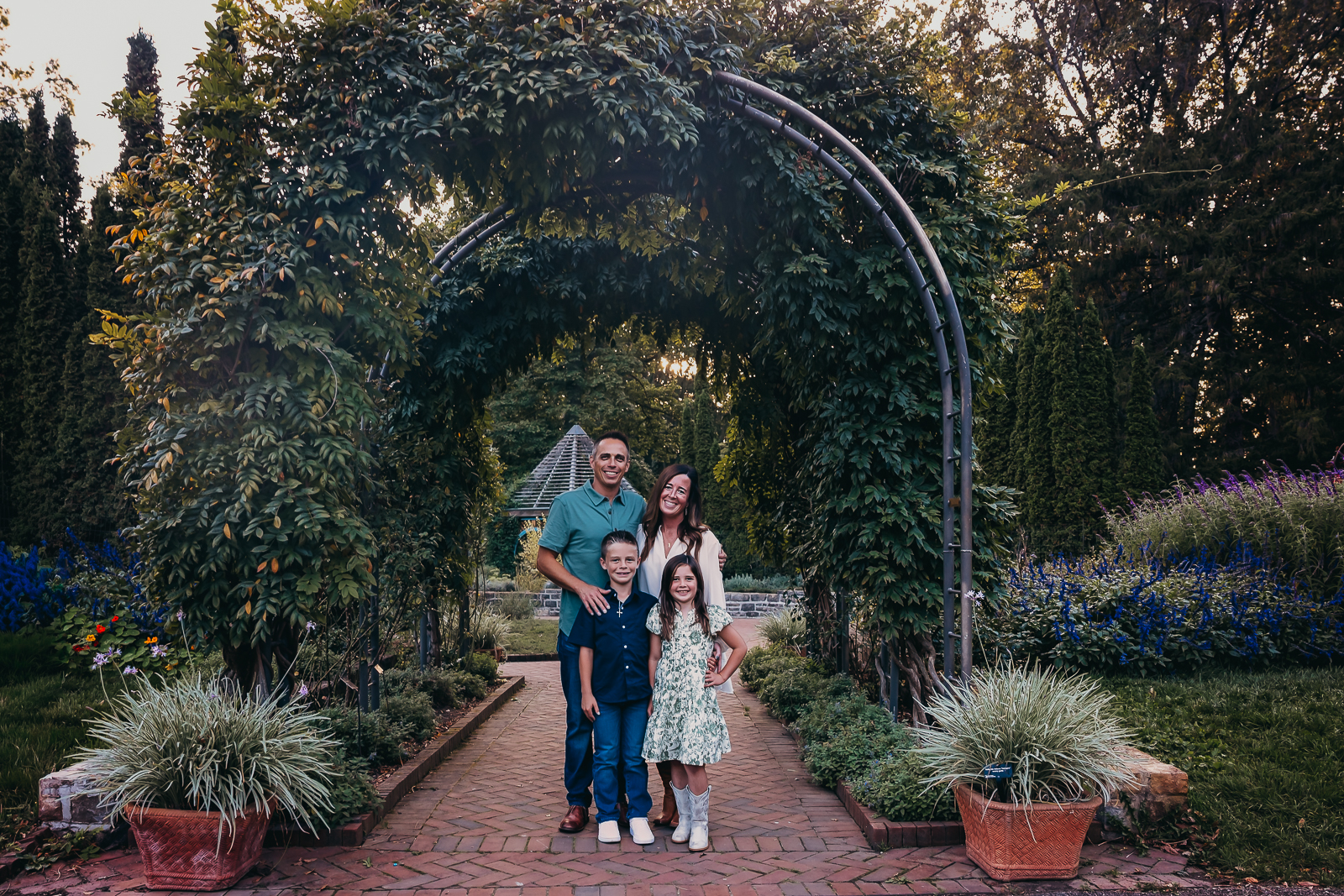 Family portrait under the arches at Innis Woods Metro park