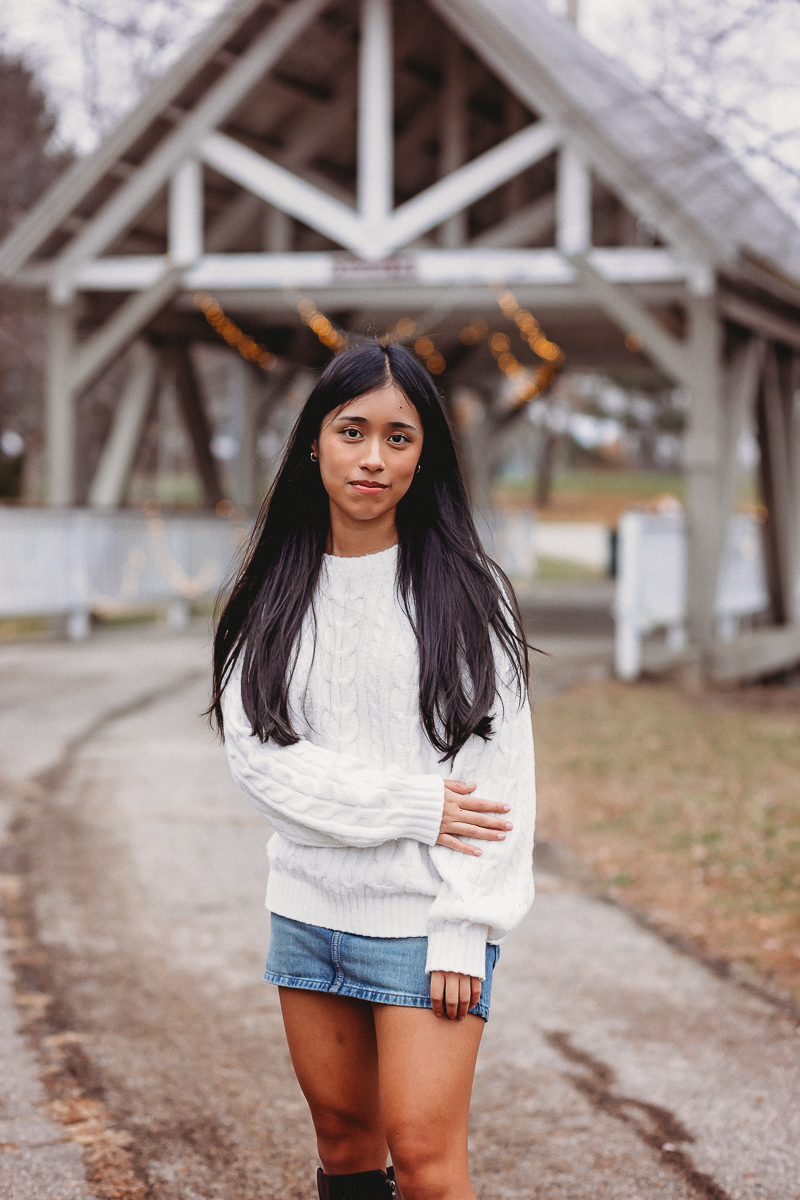 Hilliard Bradley High School Senior Kanya posting in front of the covered bridge at Homestead Park