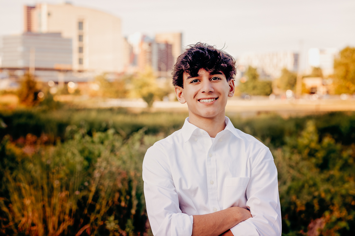 senior boy city skyline portrait at scioto audubon park