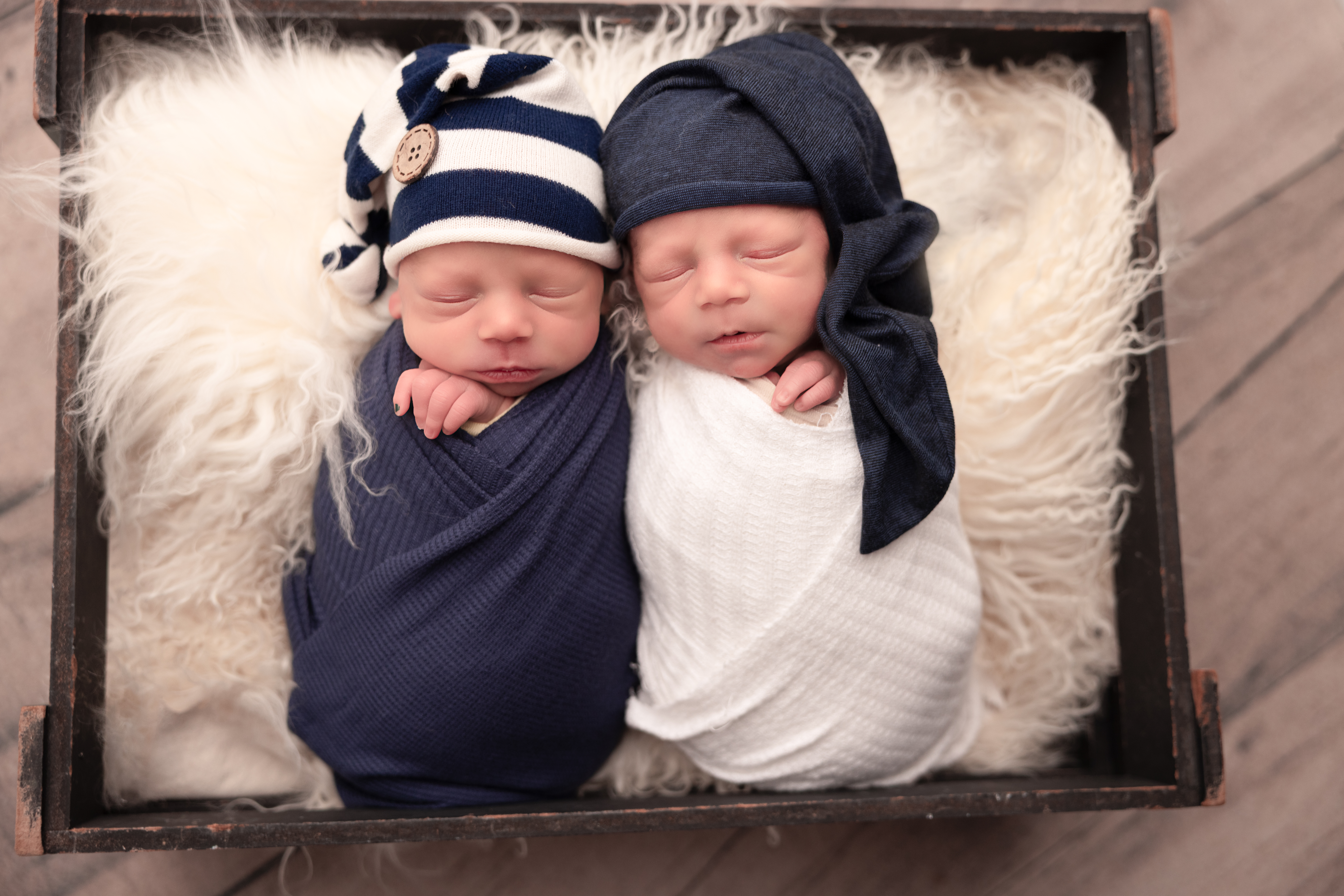 Baby boys under 10 pounds ina professional newborn wrap for a bundle me session