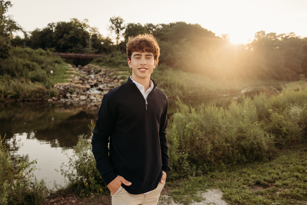Senior High School Boy with hands in pocket in front of the rocks at Quarry Trails Park